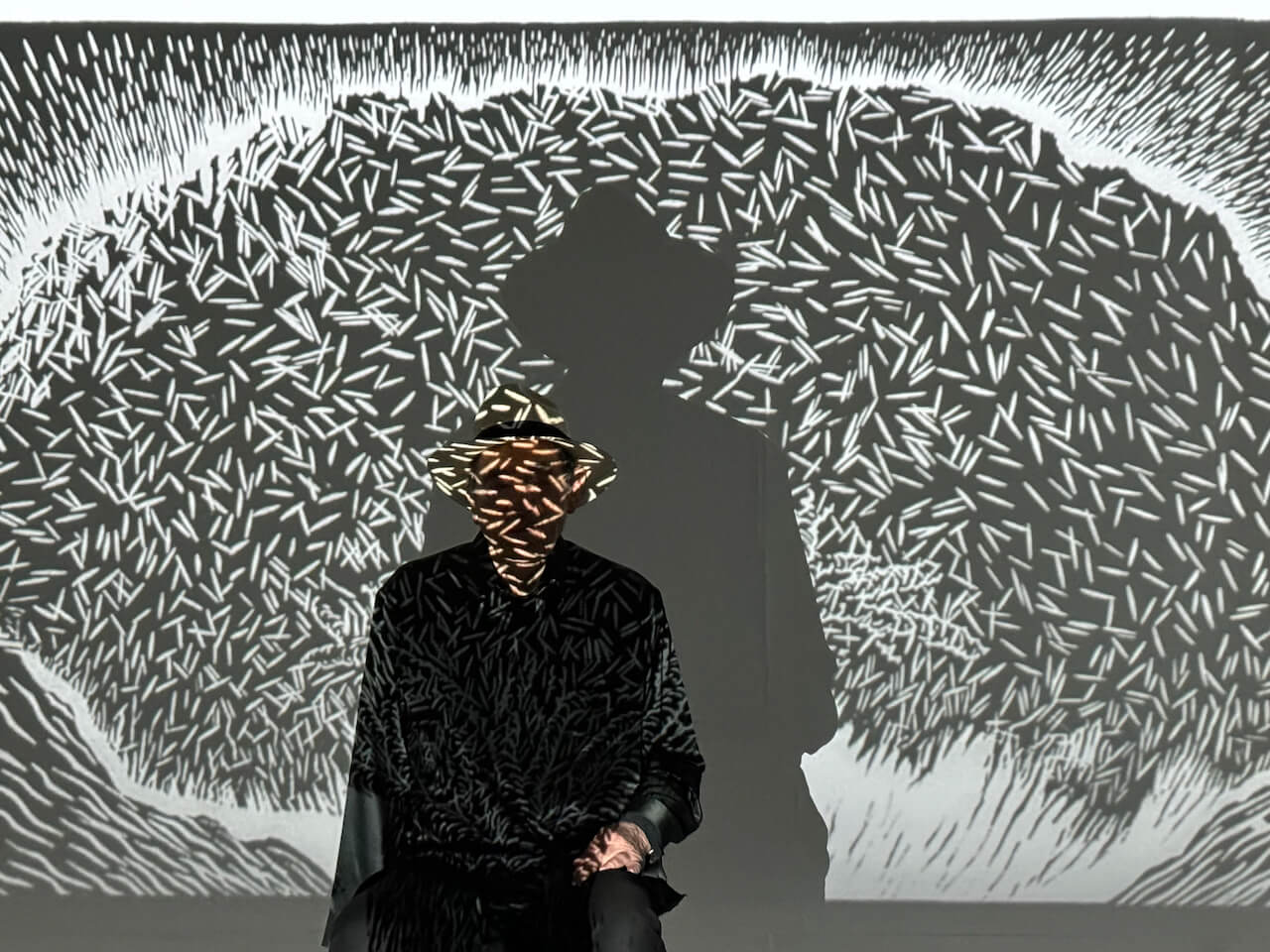 Albie with Justice under a tree artwork projection