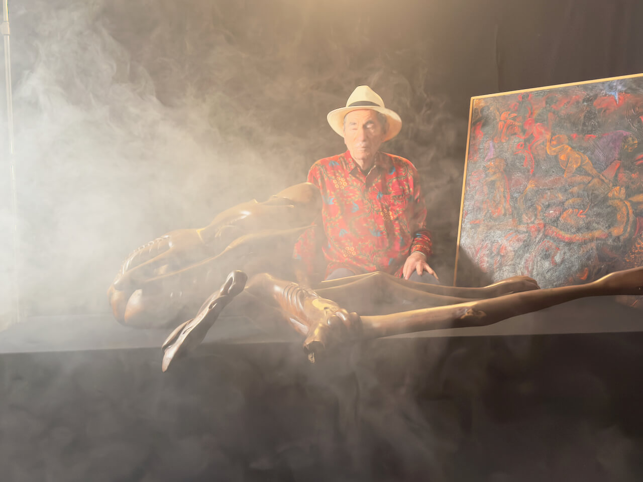 Albie with Malangatana painting and Govane sculpture in studio