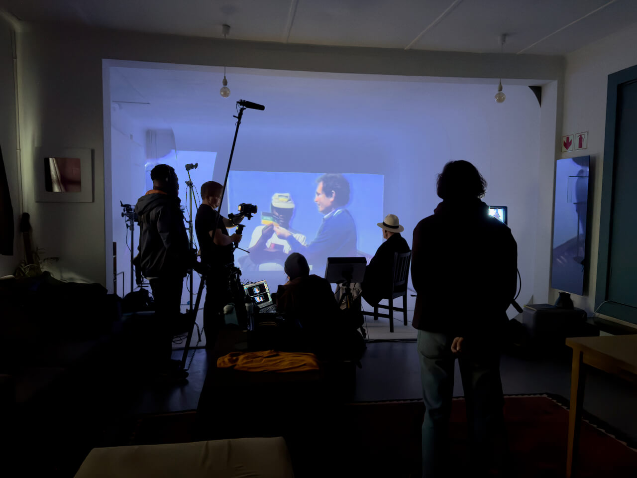 Albie watching archival projection in studio