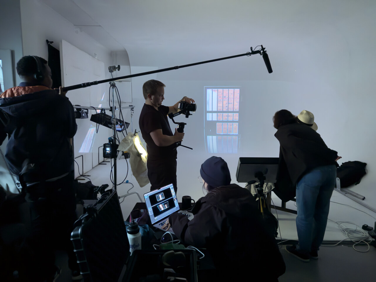Albie watching rojection of video clip from within Maitland prison cell in studio