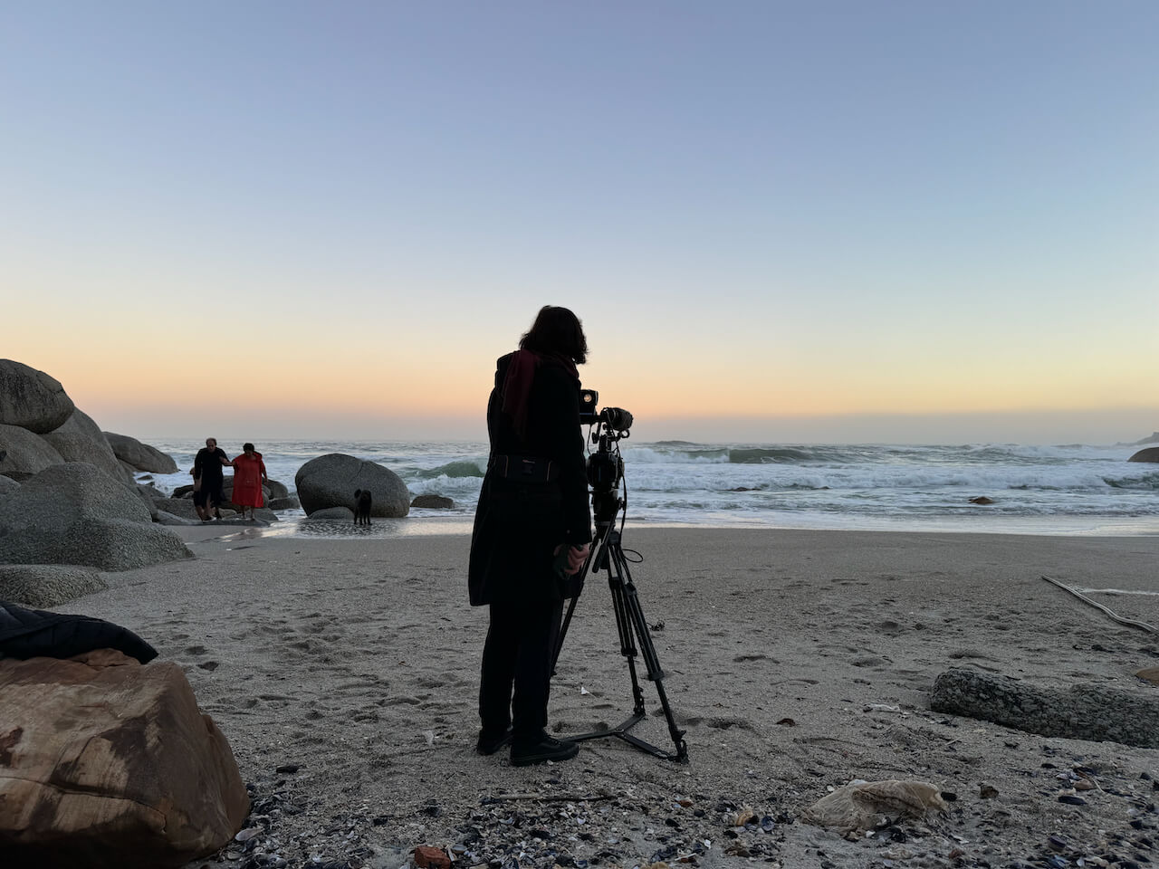 Sara Gouveia films Albie and Vanessa in sea at sunrise on beach at Clifton