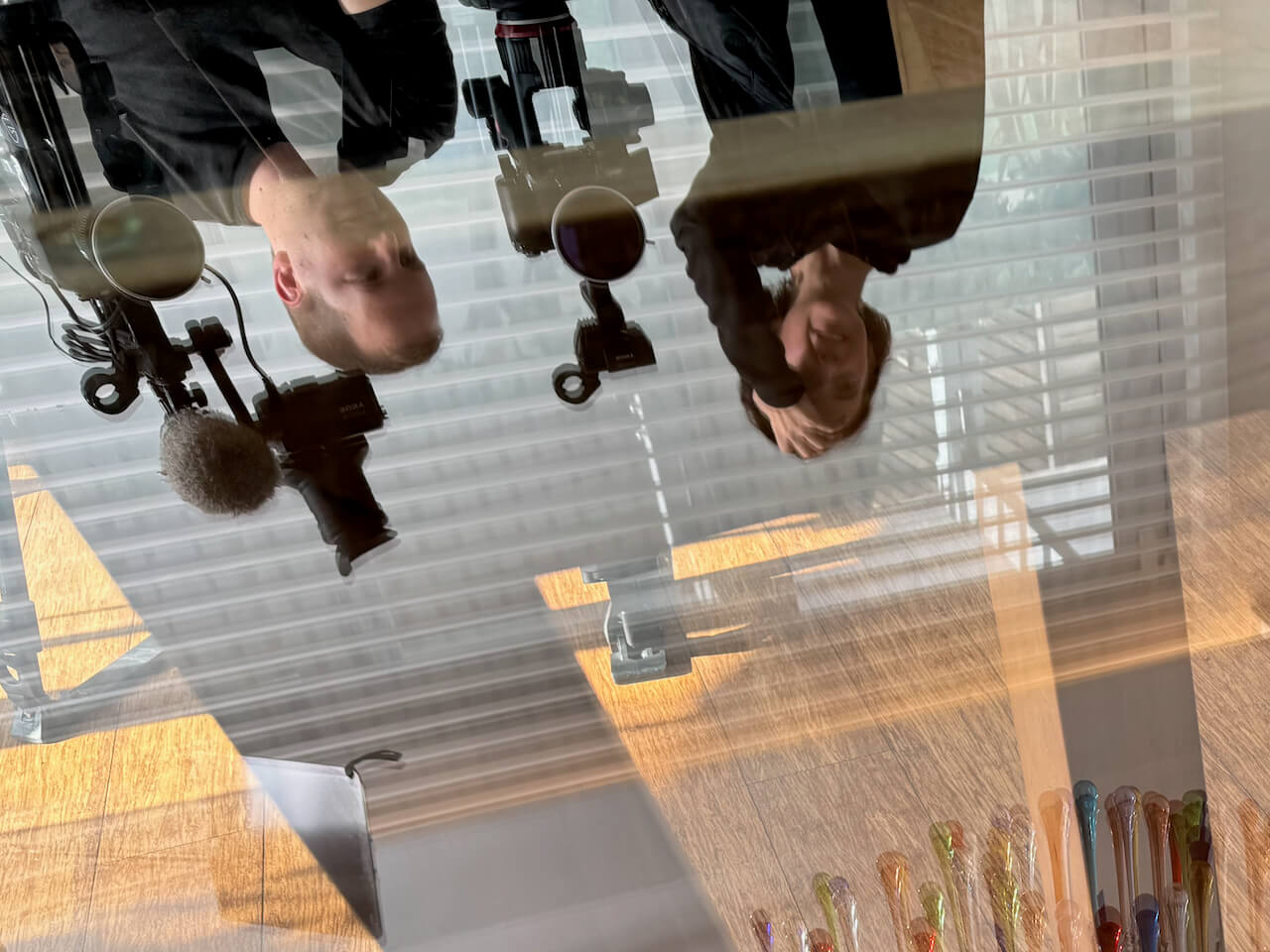 Sara Gouveia and Gray Kotze reflection in table at Clifton