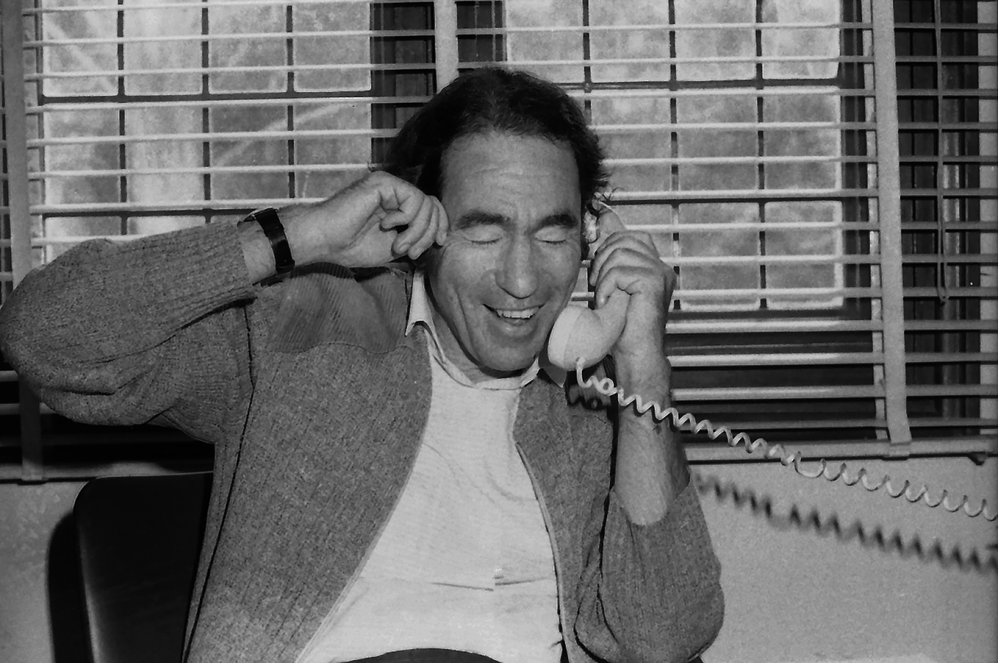 Albie on telephone in Mozambique